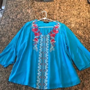 Embroidered top.  Loose fitting, slotted sleeves.